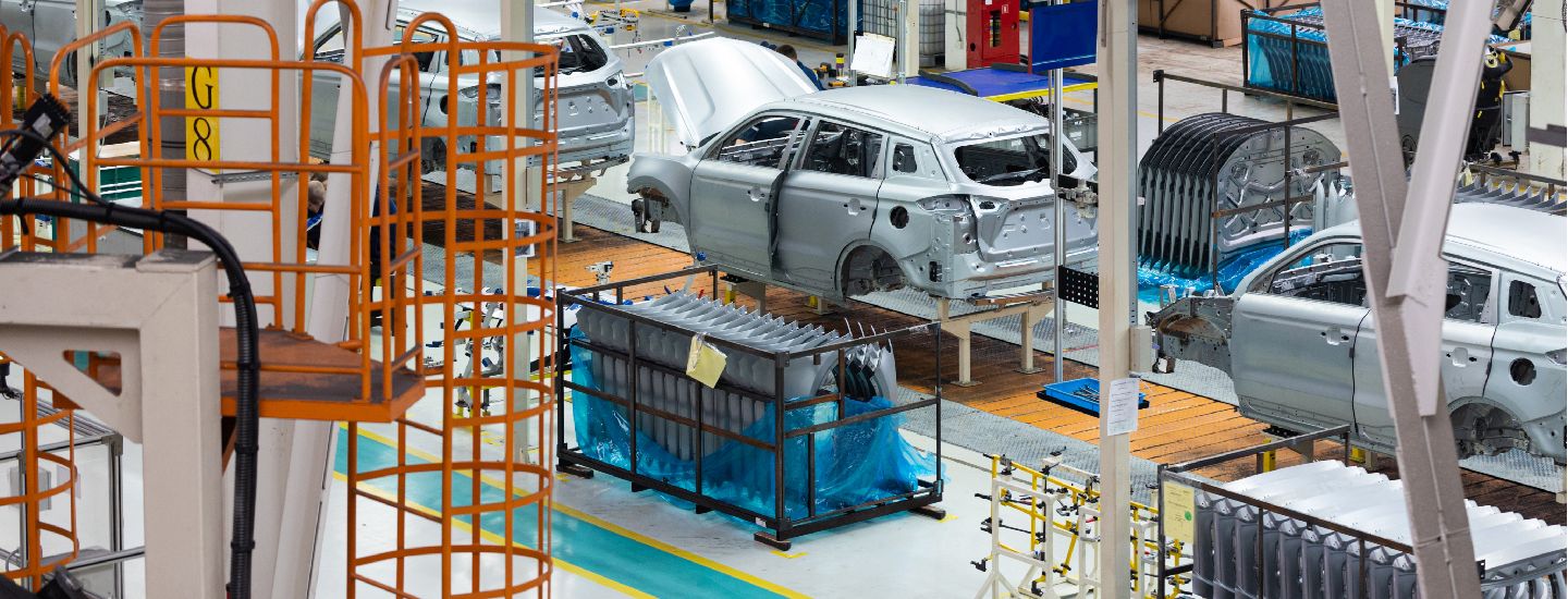 Automotive manufacturing plant illustrating global trade and supply chain risks