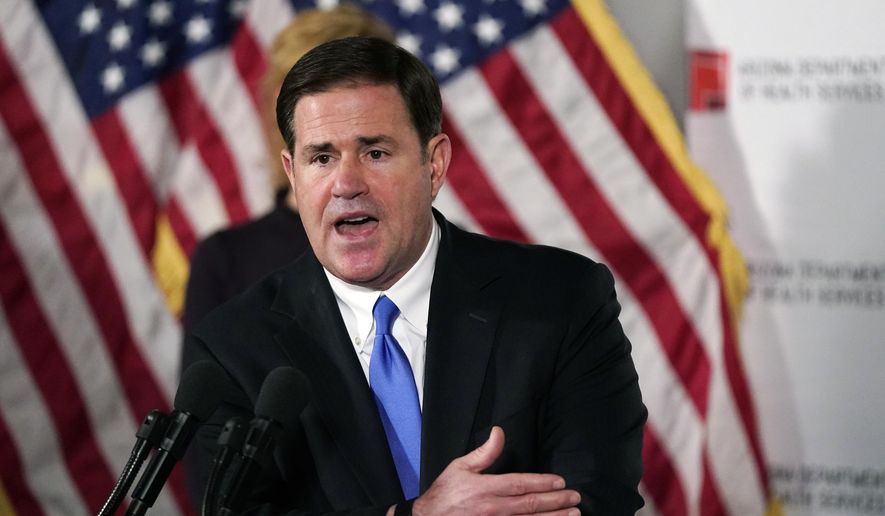 Arizona Gov. Doug Ducey answers a question during a news conference, Dec. 2, 2020, in Phoenix. (AP Photo/Ross D. Franklin, Pool, File)