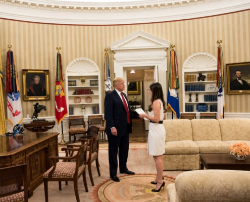Madeleine Westerhout with President Trump in the Oval Office for C-suite advisory