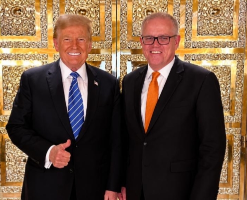 U.S. and Australian leaders pose together at a formal diplomatic meeting.
