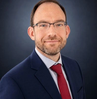 Andy Baker as Managing Director of American Global Strategies.